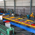 Automatic roof panel stacker for roll forming machine